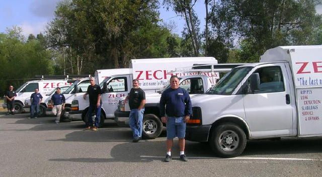 Team Zech with the fleet of Zech Plumbing vans